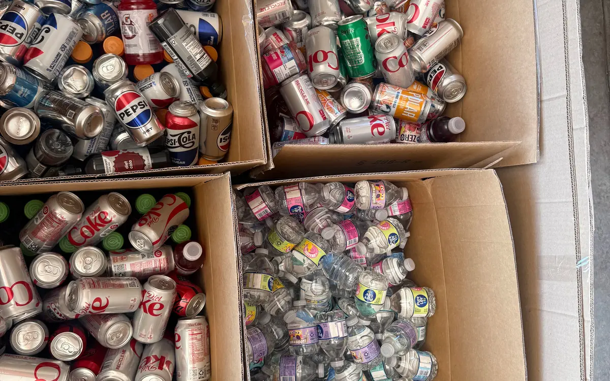 Boxes of donated canned drinks and water bottles collected for distribution